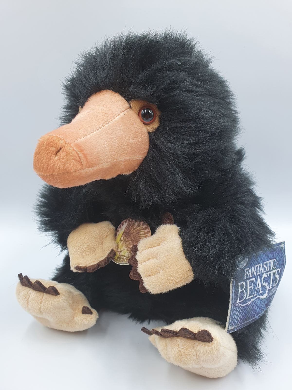 Мягкая игрушка нюхач Нюхлер (Niffler) с монетой,герой фильма "Фантастические твари и где они обитают" 20 см
Мягкая игрушка нюхач Нюхлер (Niffler) с монетой,герой фильма "Фантастические твари и где они обитают" 20 см