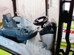 Спецтехника Bruder трактор Claas Axion 950 с погрузчиком (03013) фото от покупателей 2