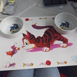 Коврик под миски для собак и кошек Trixie Comic Cat 44 x 28 см (4011905245447) фото от покупателей 12