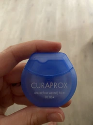 Зубная нить Curaprox вощеная с ароматом мяты 50 м (7612412428285)