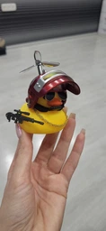 Аксессуар на торпеду в авто Crazy Duck утка в военном шлеме с оружием фото от покупателей 2