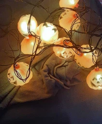 Светодиодная гирлянда "Хеллоуин тыква" 12 LED, 5м + переходник, черный провод, 220V, IP44, Теплый белый фото от покупателей 2