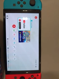 Портативна ігрова приставка Nintendo Switch OLED with Neon Blue and Neon Red Joy-Con (045496453442) фото від покупців 1