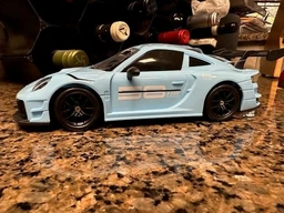 Дрифт машинка кар радиоуправляемая игрушка RC детский автомобиль на пульте управления с USB зарядкой трюковая гоночная скоростная маневренная с светом передними фарами для дома улицы игр дрифтинга бокового скольжения поворотов 360° porsche 1:24 голубой фото от покупателей 6