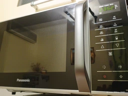 Мікрохвильова піч 25л, 800Вт, дисплей, відкрю ручкою, білий Panasonic 000330015 фото від покупців 4