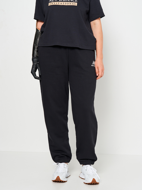 Акція на Спортивні штани на флісі жіночі New Balance Essentials Stacked Logo WP31530BK S Чорні від Rozetka