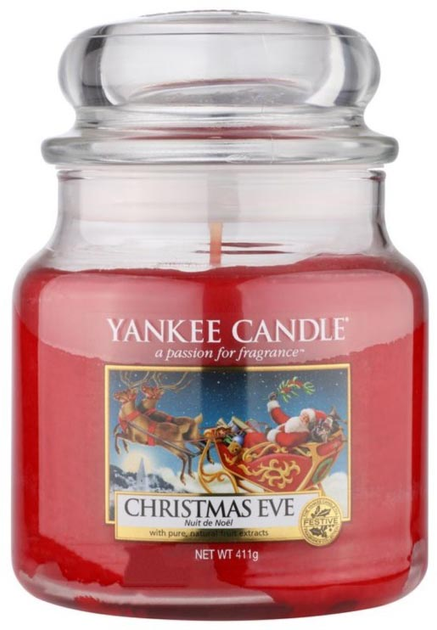Świeca zapachowa Yankee Candle średni słój Christmas Eve 411 g (5038580026962) - obraz 1