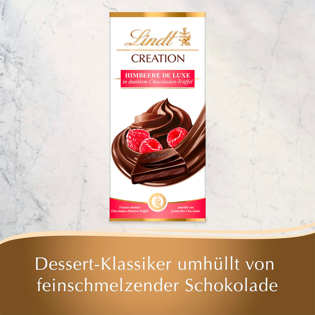 Шоколад Lindt Creation з малиновим смаком 150 г. - Фото 2 Шоколад Lindt Creation з малиновим смаком 150 г. - зображення 2