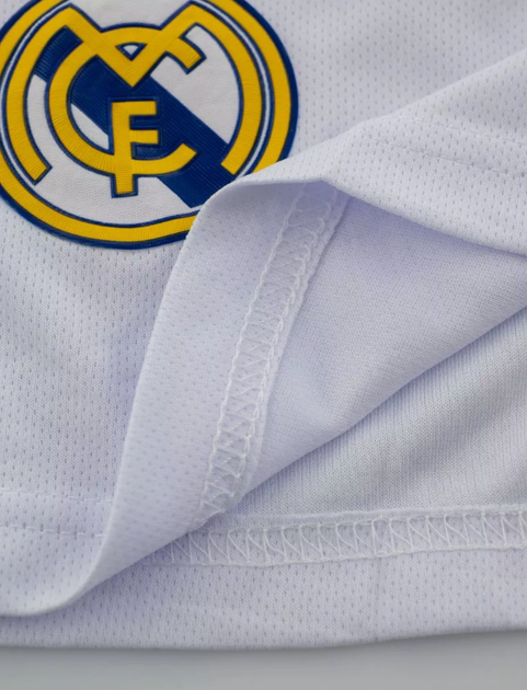 Футбольна дитяча форма Real Madrid Mbappe (Мбапе) 9 сезон 24/25 з гетрами (розмір 34-38) та щитками розмір 20 ріст 120-127 см біла - Фото 6 Футбольна дитяча форма Real Madrid Mbappe (Мбапе) 9 сезон 24/25 з гетрами (розмір 34-38) та щитками розмір 20 ріст 120-127 см біла - зображення 6