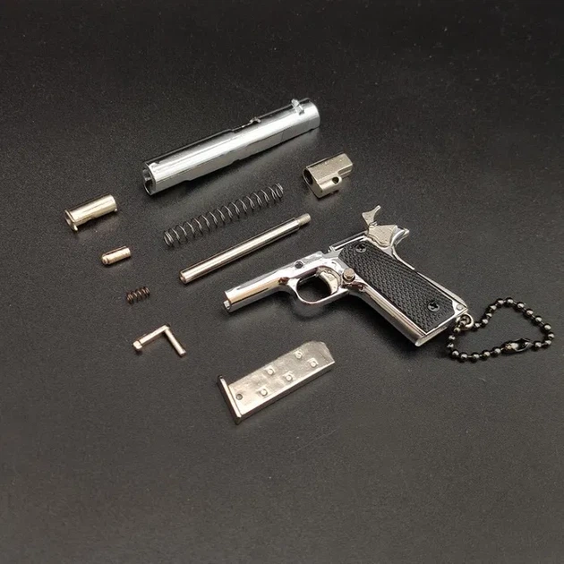 Сувенірний Пістолет COLT 1911 CLASSIC сірий, розбірний брелок з металу 1:3 фіджет - Фото 3 Сувенірний Пістолет COLT 1911 CLASSIC сірий, розбірний брелок з металу 1:3 фіджет - зображення 3