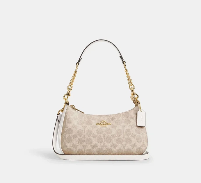 Жіноча сумка Coach Teri Shoulder Bag Signature Canvas Light Khaki Кросбоді Багет Біла - Фото 1 Жіноча сумка Coach Teri Shoulder Bag Signature Canvas Light Khaki Кросбоді Багет Біла - зображення 1