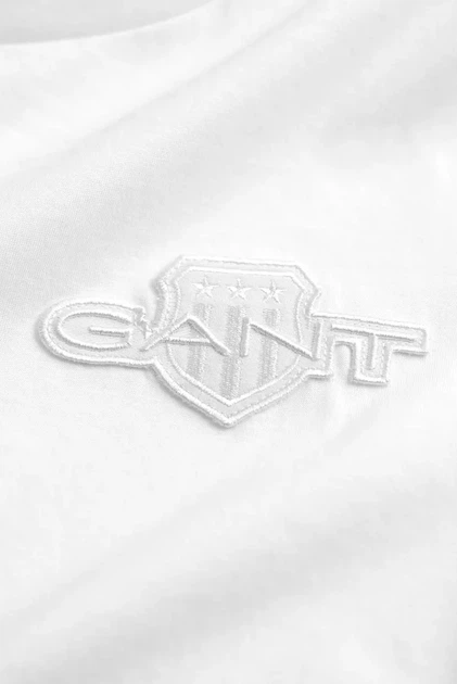 Жіноча біла футболка REG TONAL SHIELD SS Gant XS 4202589 - Фото 5 Жіноча біла футболка REG TONAL SHIELD SS Gant XS 4202589 - изображение 5