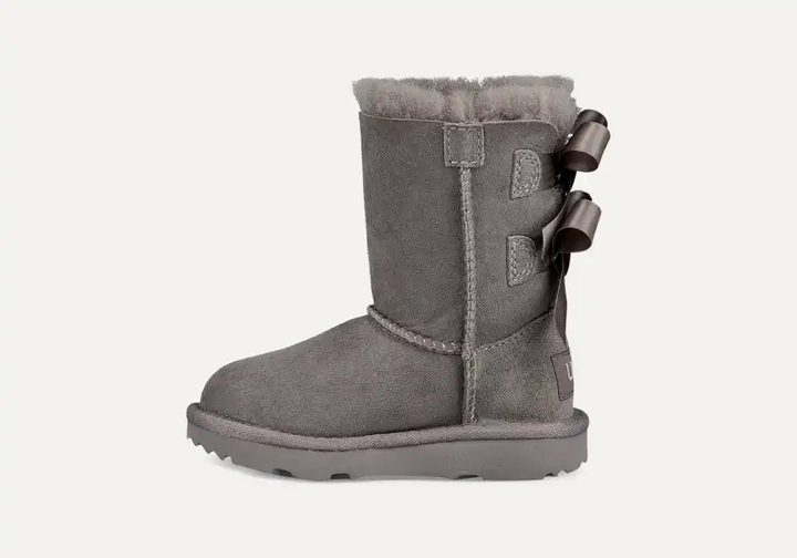 Дитячі уггі для дівчинки Середні Замша сірі з Гудзиком Ugg Bailey Bow Grey (25, сірий) - Фото 1 Дитячі уггі для дівчинки Середні Замша сірі з Гудзиком Ugg Bailey Bow Grey (25, сірий) - зображення 1