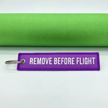 Брелок Remove Before Flight Бузковий