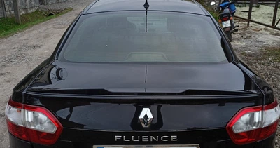 Спойлер LIP (Sunplex, черный) (125,4см*7,2см) для Renault Fluence 2009-2016 гг
