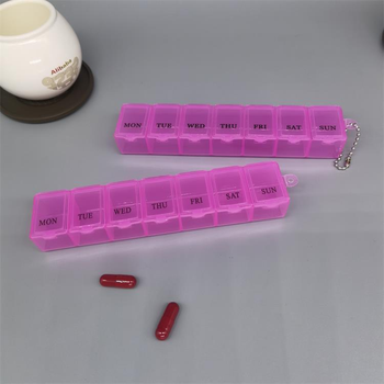 Таблетниця органайзер для таблеток на 7 комірок 1 тиждень з ланцюжком Рожевий