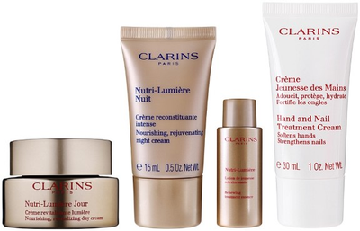 Набір косметики по догляду Clarins Nutri-Lumiere Денний крем для обличчя 50 мл + Нічний крем для обличчя 15 мл + Крем для рук 30 мл + Лосьйон для обличчя 10 мл + Косметичка (3666057194610)