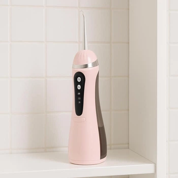 Іригатор для ротової порожнини портативний акумуляторний 200 мл Oral Irrigator, з 4 насадками для догляду за зубами, яснами та брекетами Рожевий, AND-1-37-Pink