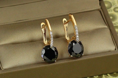 Серьги Xuping Jewelry Стрелка с родием с большим черным камнем 2,7 см золотистые