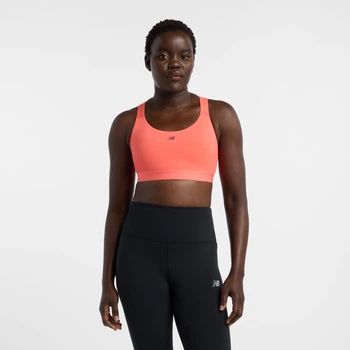 Женский розовый топ New Balance NB Essential Train Bra 34 (XS) (WB51035DTR)
