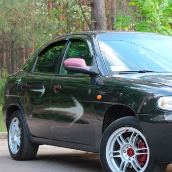 Дефлекторы окон VL-Tuning на Daewoo Nubira 97-03 седан/хэтчбек (накладные)
