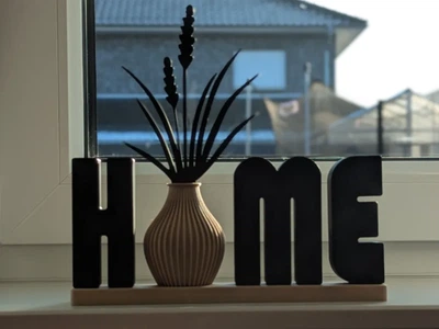 Статуетка буквене позначення home з вазою. Aivory