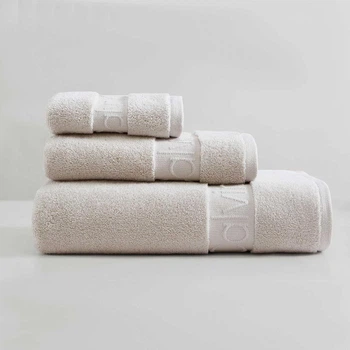 Calvin Klein махровые полотенца из плотного однотонного 100% хлопка с брендированным кантом (3 штуки – комплект для одного) – бежевый