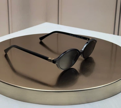 Сонцезахисні окуляри Miu Miu SMU 04Z - F чорні овальні вузькі ацетатні, сіра лінза, жіночі,