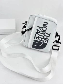 Сумка через плече The North Face, білого кольору.