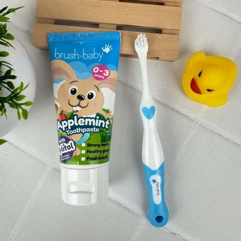 Набір Brush-Baby для перших зубів (паста Зайчик 50 мл + 1 щітка First Brush блакитна)