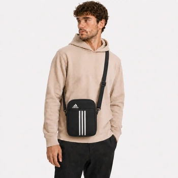 Сумка через плечо Adidas черно-белого цвета.