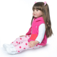 Кукла реборн NPK DOLL девочка Ким силиконовая с заколками и кроссовками 60 см - изображение 2