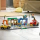 Zestaw klocków LEGO City Ulica handlowa 533 elementy (60306) - obraz 5
