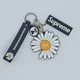 Брелок Jsstore Ромашка Білий/Чорний На рюкзак ключі одяг - зображення 1