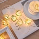 Светодиодная гирлянда металлические Сердечки 10 LED на батарейках 2 м Желтый - изображение 4