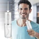 Портативный ирригатор для зубов и полости рта Portable Oral Irrigator FC 1591 230 мл бытовой - изображение 5