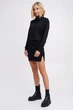 Трикотажний костюм гольф + міні спідниця з розпоркою Подіум 28200-BLACK S Чорний - зображення 1