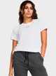 Футболка длинная женская Under Armour UA Rival Core SS 1383648-100 XS Белая (196885502088) - изображение 1