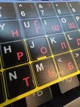 Нестирающиеся наклейки на клавиатуру Украинский / Английский / ru 12х12 мм черный фон / красные символы Nalepi - изображение 3