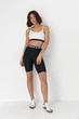 Жіночий костюм з велосипедними шортами та топом - чорний колір, розмір S - зображення 8