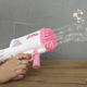 Пистолет с мыльными пузырями Бабл бластер WToys розовый акум 3,7 V цветная подсветка 32 отверстия мыльный раствор 27*8*20см (49076) - изображение 3