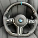 Руль для BMW в M-стиле с подушкой безопасности, с лепестками. Черный/ карбон - изображение 1