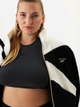 Толстовка на блискавці утеплена на флісі жіноча Reebok Cl Winter Tracktop 100208561 L Чорна (1200143802885) - зображення 4