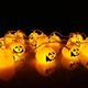 Светодиодная гирлянда "Хеллоуин тыква" 12 LED, 5м + переходник, черный провод, 220V, IP44, Теплый белый - изображение 4