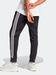 Spodnie dresowe męskie adidas Fleece 3-Stripes Tapered Cuff IB4030 L Czarne (4066762310104) - obraz 2