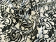 Тканина Костюмна Бель квіткові силуети, бежевий на чорному, пог. м. (п322, 2403109A, д3 цв1) - зображення 1