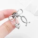 Значок (пин) BROCHE брошь бижутерия Медицина Стетоскоп с бантом серебристый BRGV114367 - изображение 2