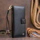 Женский кошелек ST Leather из натуральной кожи черный вертикальный на хлястике с кнопкой 19х9х1 7 см 56542 - изображение 7