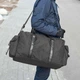 Вместительная мужская дорожная сумка Сross на 55 литров черная тканевая со вставка из эко кожи - изображение 5