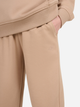 Spodnie dresowe dziewczęce joggery 4F 4FJWSS25TTROF1187-83S 122 cm Beżowe (5905700426189) - obraz 5